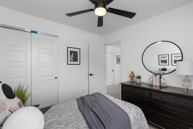 Bedroom with ceiling fan, carpet floors, and a closet | Image 18