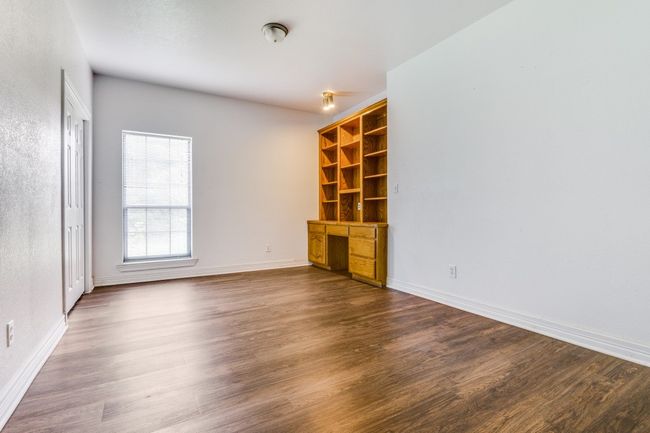 Unfurnished room with dark wood finished floors and baseboards | Image 11