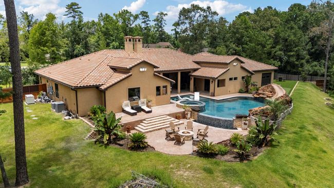 Arieal view shows additional outdoor living space with firepit. All pool equipment and whole house generator to your left. | Image 11