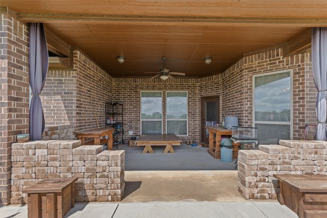 View of patio with ceiling fan | Image 18