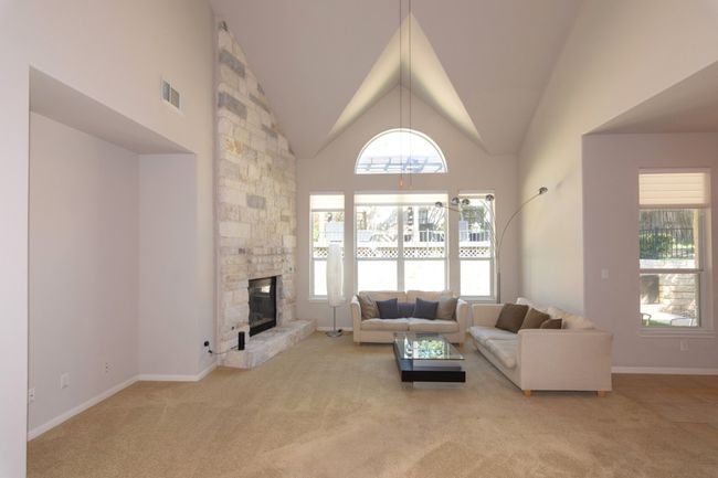 Living room featuring a wealth of natural light, visible vents, and carpet floors | Image 29