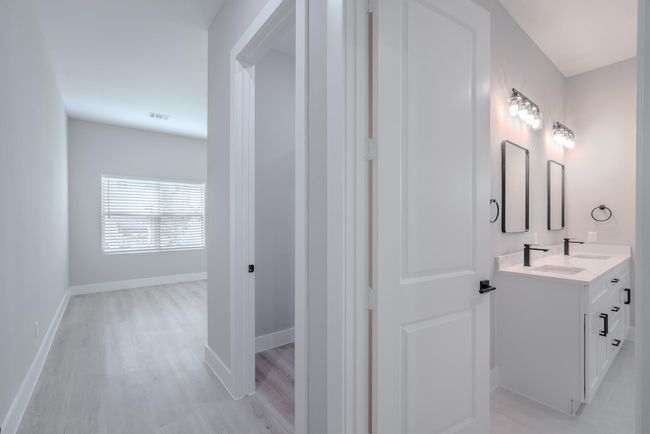 Primary bedroom's ensuite design adds convenience and privacy | Image 21