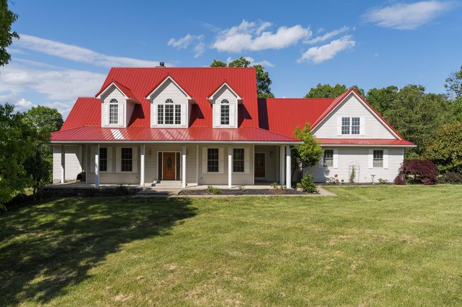Eye Catching curb appeal with red metal roof. | Image 7