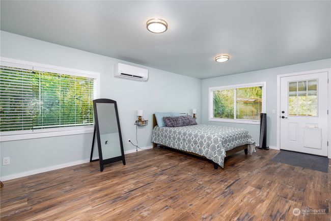 Primary bedroom with private outside deck and has AC on main level | Image 18