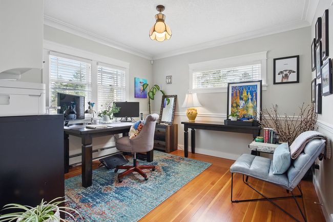 Office area featuring hardwood / wood-style flooring, a healthy amount of sunlight, and ornamental molding | Image 13