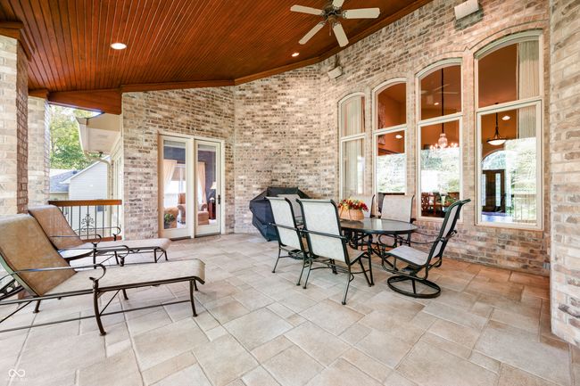 view of patio / terrace featuring a ceiling fan and outdoor dining space | Image 57