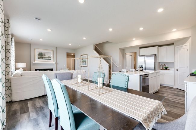 Dinette adjacent to the kitchen helps keep the conversation open and flowing from wherever you are on the main level. Previously built model home, finishes, selections, and colors to vary from future built home. | Image 12