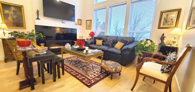 Living area with wood finished floors | Image 23