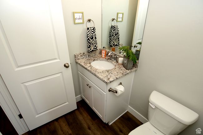 Bathroom with vanity and wood finished floors | Image 8