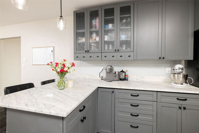 Bar with decorative light fixtures and decorative backsplash | Image 12