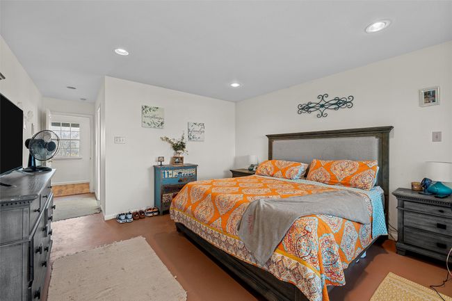 Bedroom with recessed lighting and concrete floors | Image 16