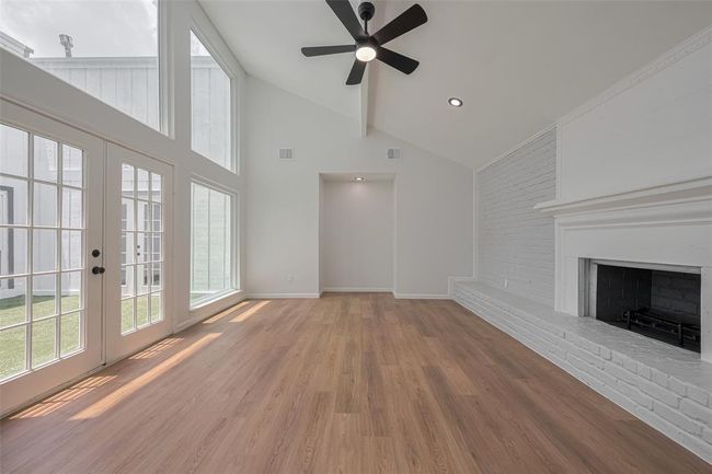 Living room that looks out to the atrium/sun room. | Image 9