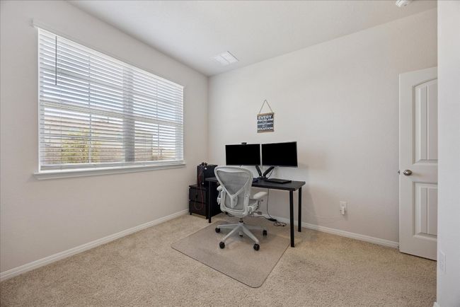 Carpeted office space with baseboards | Image 8