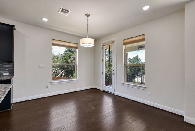 Unfurnished dining area with dark wood-type flooring and recessed lighting | Image 14