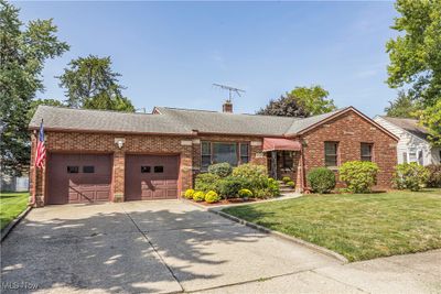 Single story home with a garage and a front lawn | Image 3