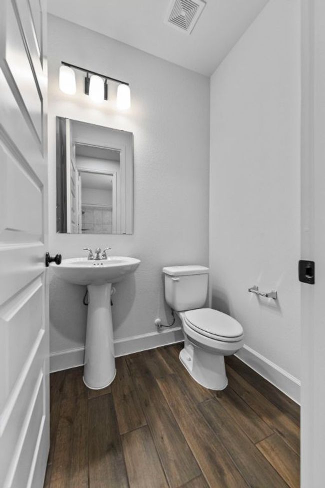Half bath featuring baseboards and wood finished floors | Image 18