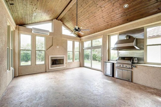 Outside Covered Patio with Fireplace and Grill and Air-conditioning | Image 4