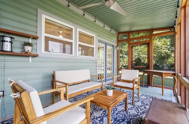 Sunroom featuring ceiling fan and an outdoor hangout area | Image 22