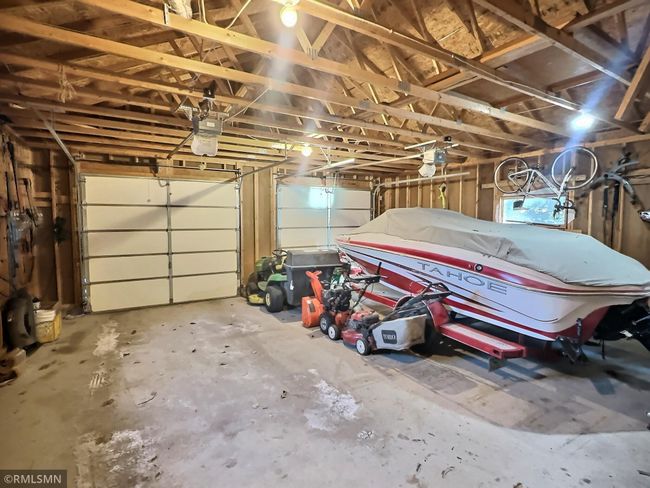 The double attached garage is ideal for all your needs. Bonus - the boat and trailer come with the purchase! | Image 30