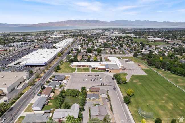 Aerial view of property and surrounding area with a mountain backdrop and Utah Valley University and I-15 | Image 38