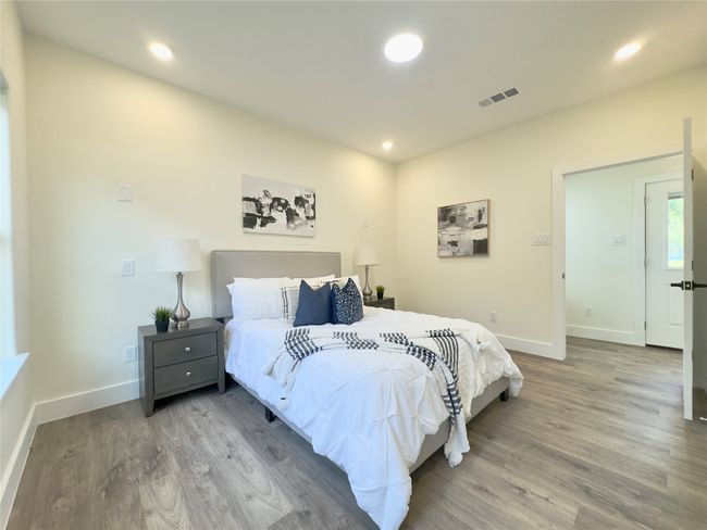 Bedroom featuring wood finished floors, visible vents, recessed lighting, and baseboards | Image 15