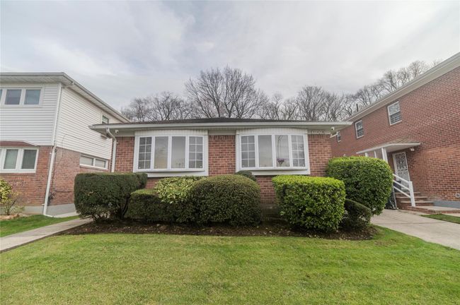 View of front of property featuring a front yard and brick siding | Image 33
