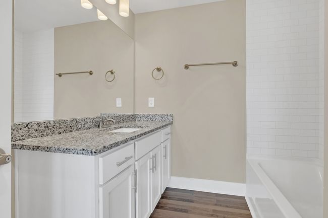 Full bath w/granite-topped vanity w/storage | Image 19