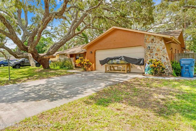 8268 Garrison St, House other with 3 bedrooms, 3 bathrooms and null parking in Spring Hill FL | Image 4