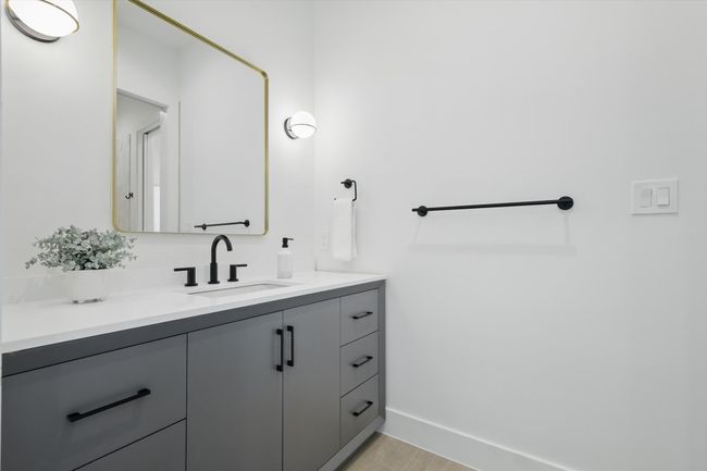 Bathroom featuring baseboards and vanity | Image 30