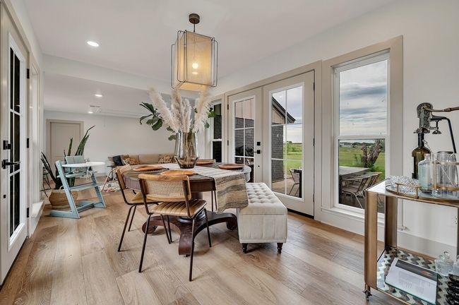 Dining space with french doors, light wood-style flooring, and recessed lighting | Image 18