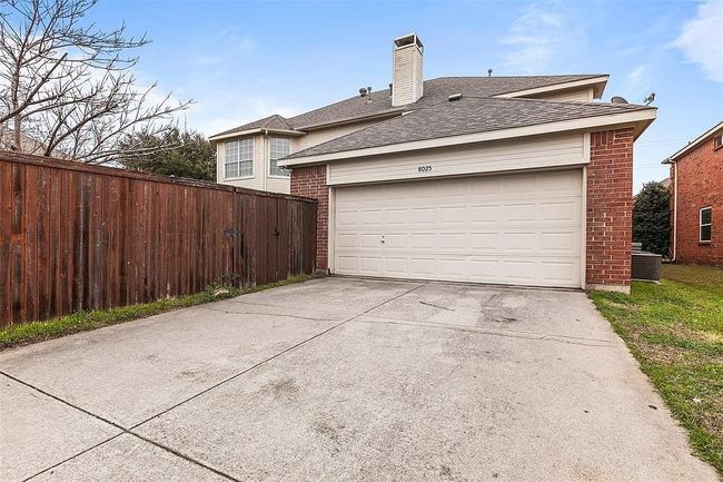 Garage featuring driveway and fence | Image 27