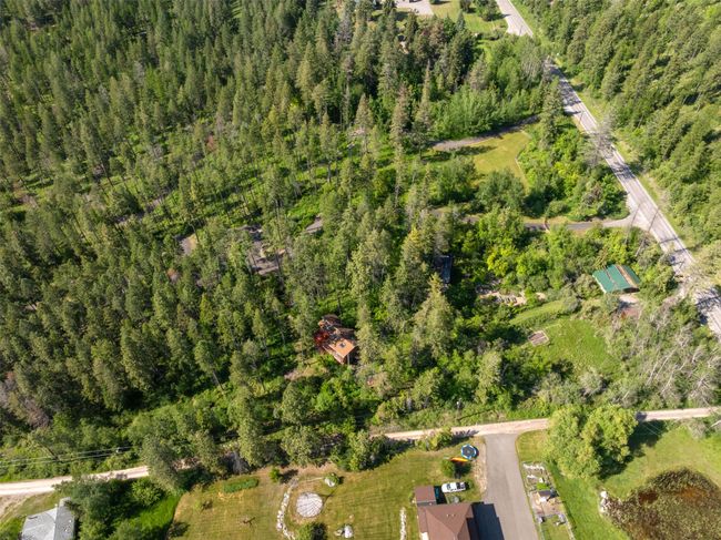 View of property location with a heavily wooded area | Image 18