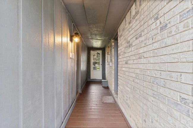 Covered entryway creating a welcoming entrance. | Image 32