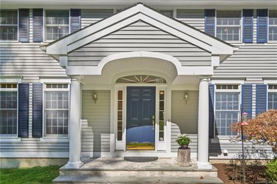 Property entrance has covered porch | Image 2