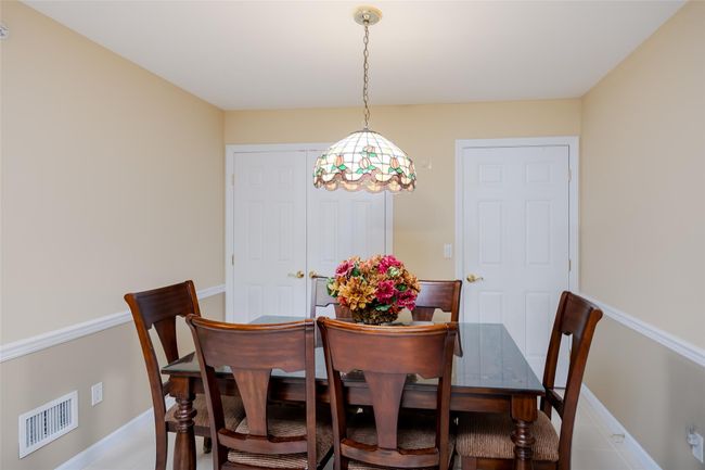 Dining space with baseboards | Image 16