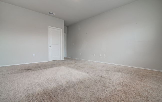 Empty room featuring visible vents, baseboards, and carpet flooring | Image 17