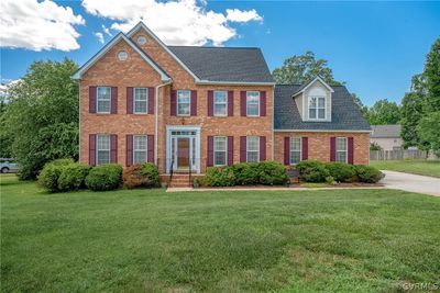 Colonial house with a front lawn | Image 1