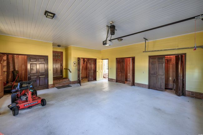 Garage with a garage door opener | Image 27