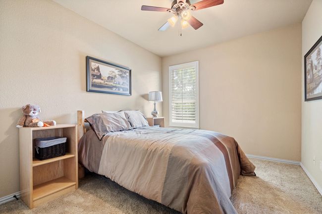 One of the three secondary upstairs bedrooms, all with walk-in closets | Image 28