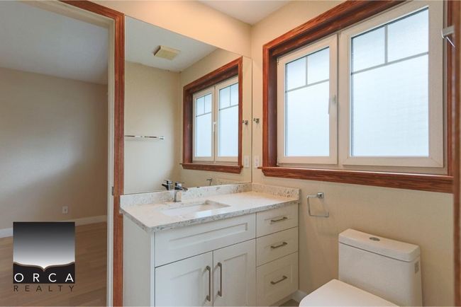 Bathroom with vanity and wood finished floors | Image 28