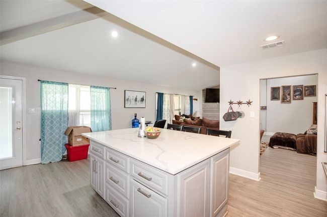 Lots of cabinet space within the island | Image 12