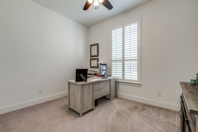 Office space with baseboards, a ceiling fan, and light colored carpet | Image 21