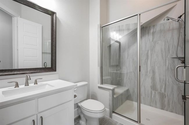 Full bath with a shower stall, toilet, and vanity | Image 23
