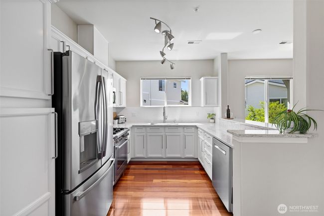 Additional view of kitchen with new SS appliances | Image 16