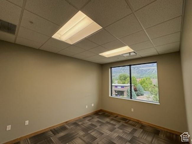 Unfurnished room with a paneled ceiling | Image 29