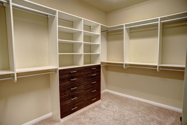 Walk-in closet with many built ins | Image 10