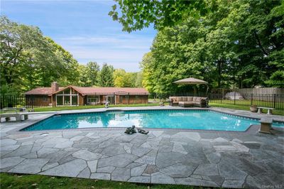 View of pool featuring a patio area | Image 2