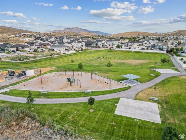 Aerial perspective of suburban area featuring a mountainous background and a community park | Image 47