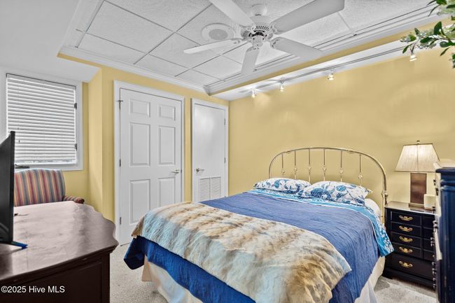 Primary Bedroom with closets, 1st TV with remote, "low dresser" & bedside table | Image 27