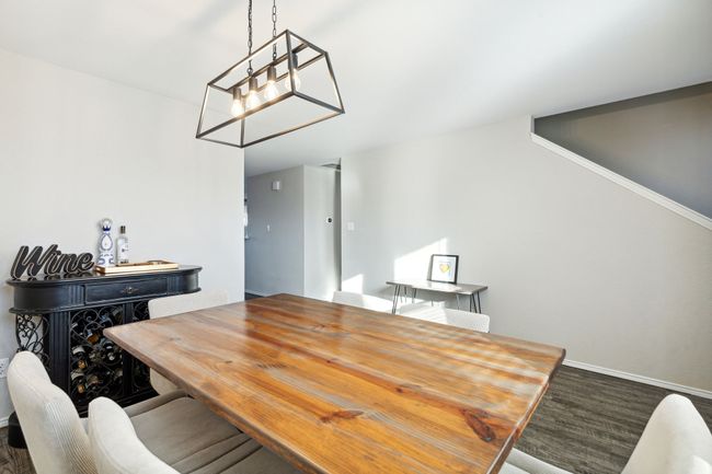 Dining area is located just off the front door to the right and kitchen and living on the left | Image 10